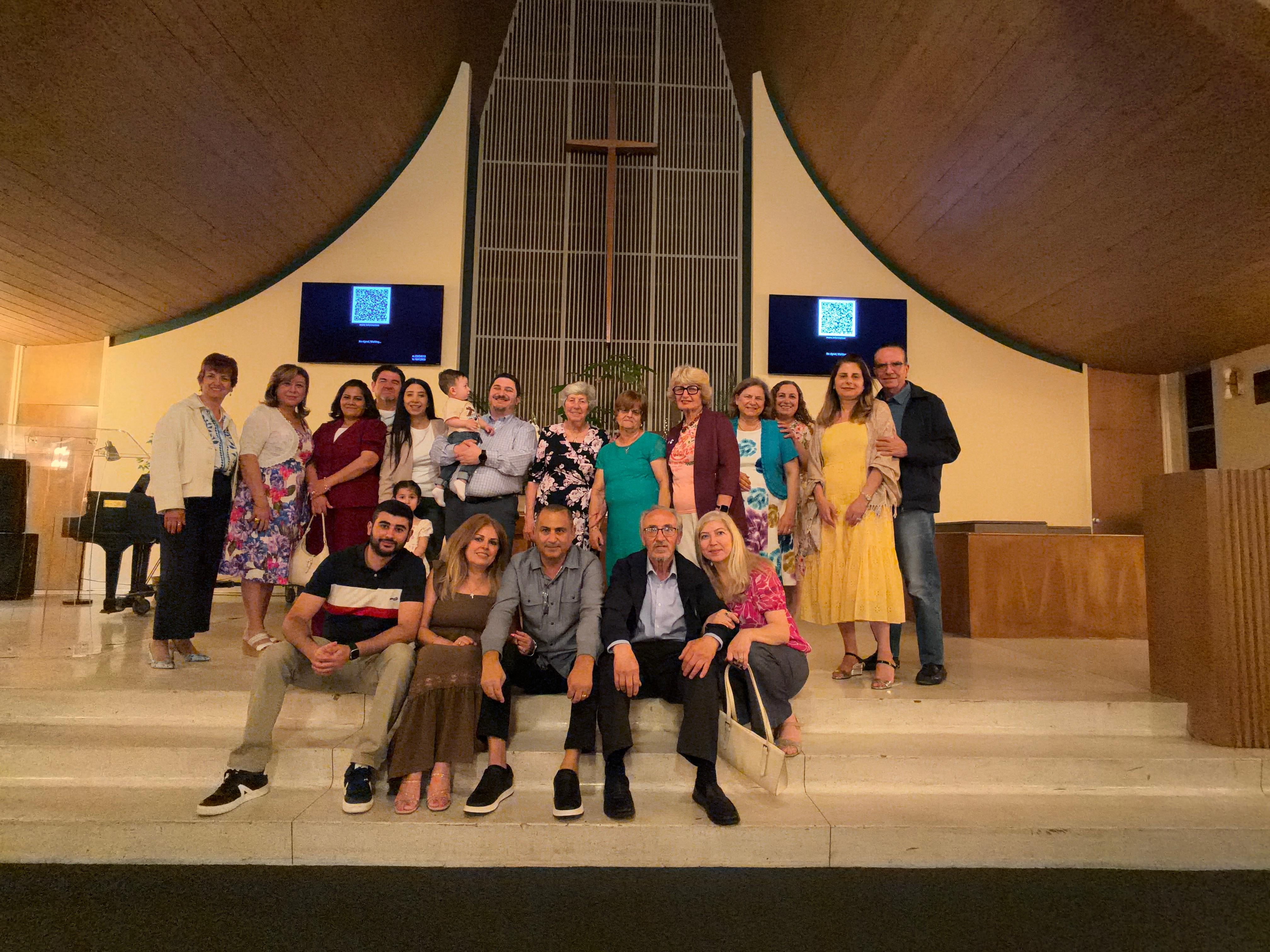 A church community gathered together in a sanctuary